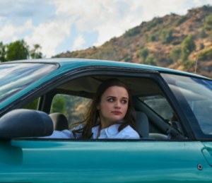 Joey King sitting inside the car 