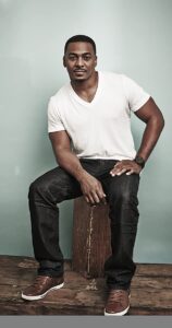 Caption: RonReaco Lee posing for photo