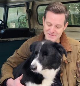 Caption: Matt Baker and his pet on his car