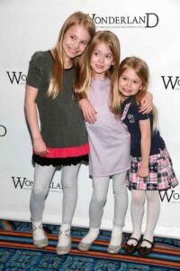 Caption: Erin Gerasimovich with her sisters