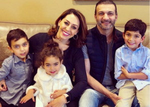 Caption: Shally Zomorodi with her husband and their children