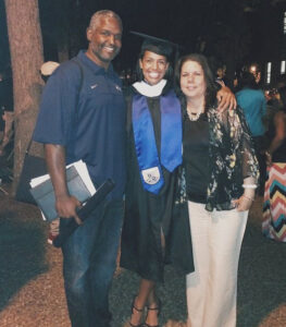 Caption: Mariah Riddlesprigger with her parents