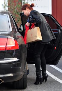 Caption: Debra Messing with her car