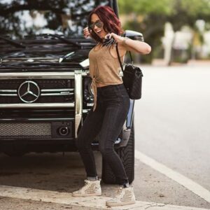 Caption: Jaclyn Hill with her car