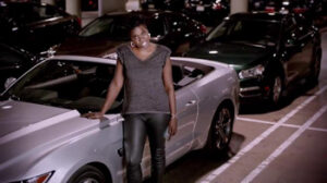 Caption: Leslie Jones with her car