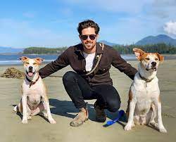 Caption: Entertainer Chris McNally with his dogs