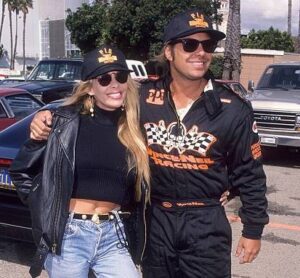 Caption; Sharise Ruddell with her car and Vince Neil