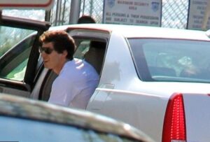 Caption: Andy Samberg with his car