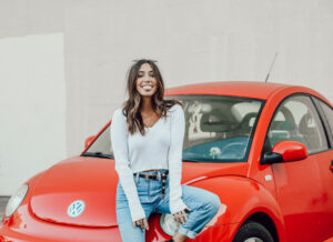Caption: Tara Massicotte with her car