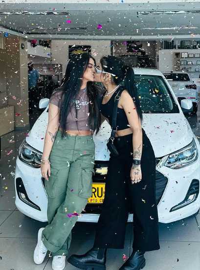 Caption: Yurielkys Ojeda and her girlfriend Hisoyvaleria celebrating new car
