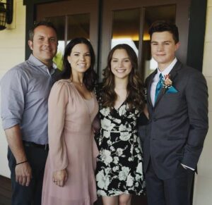 Caption: Zayne Emory, with his family